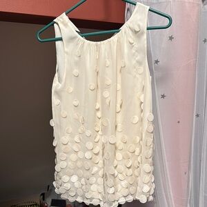 Chic Ivory Sleeveless Top with beautiful Accents perfect for the holidays.